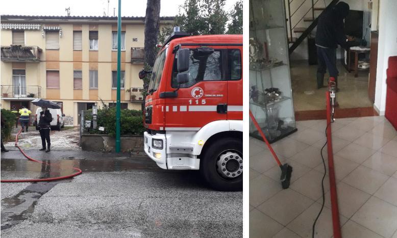 L’intervento dei vigili del fuoco a Tirrenia e, a destra, le pompe in funzione per liberare la casa dall’acqua