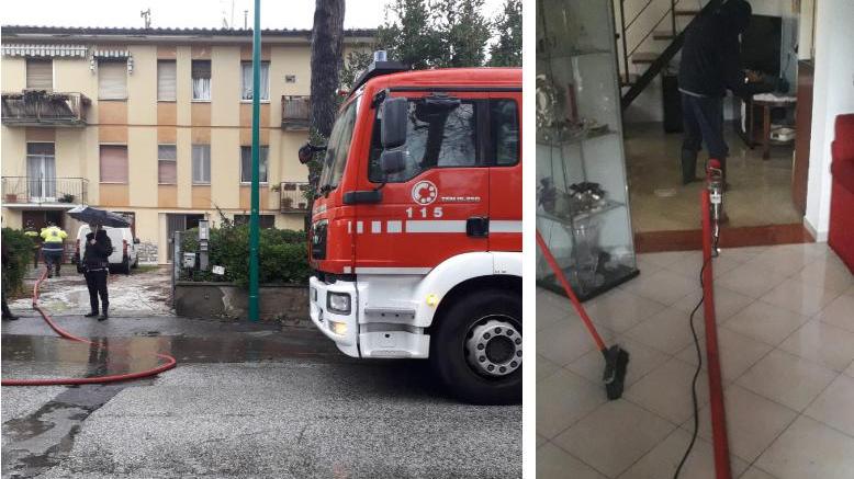L’intervento dei vigili del fuoco a Tirrenia e, a destra, le pompe in funzione per liberare la casa dall’acqua