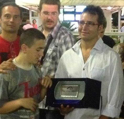 Erik Fumi premiato con una targa 